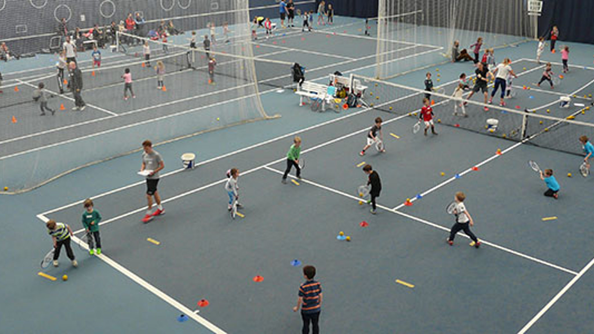 Kids tennis coaching session