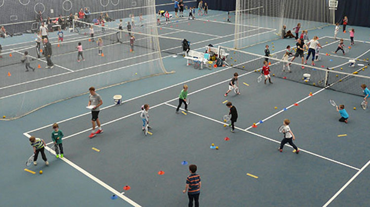 Kids tennis coaching session