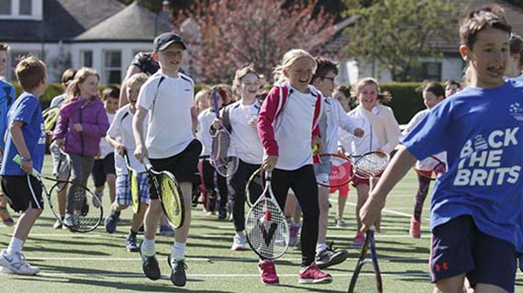 Children running with tennis rackets at Clarkston Tennis Club