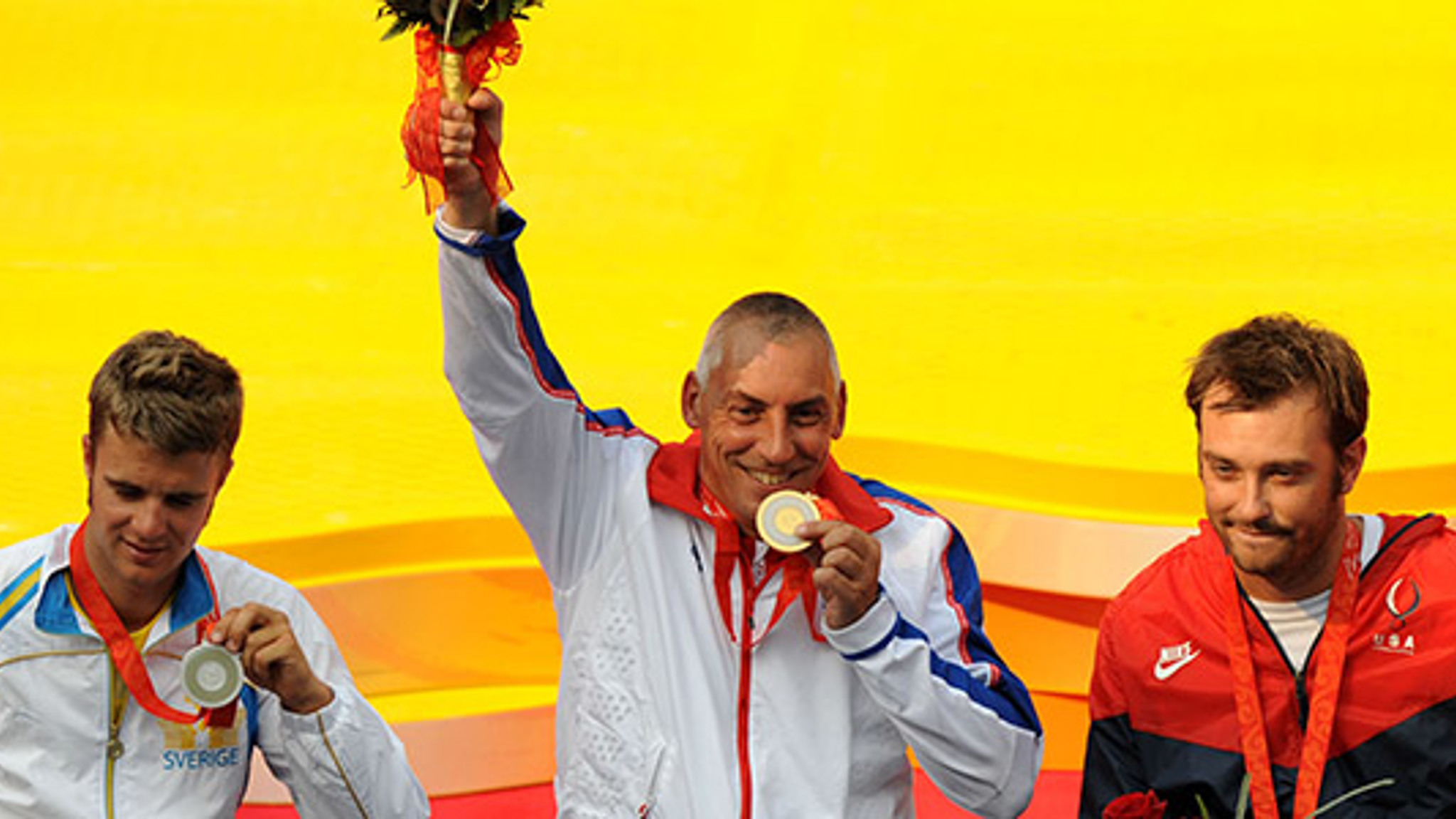 Three tennis players celebrating their victory
