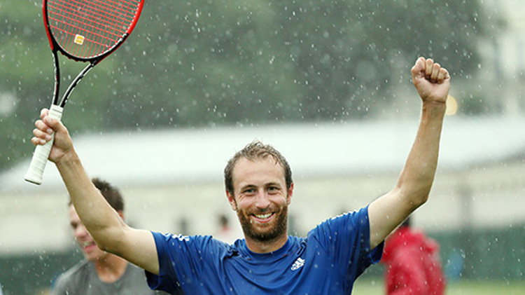 Thomas Rushby celebrating in the rain