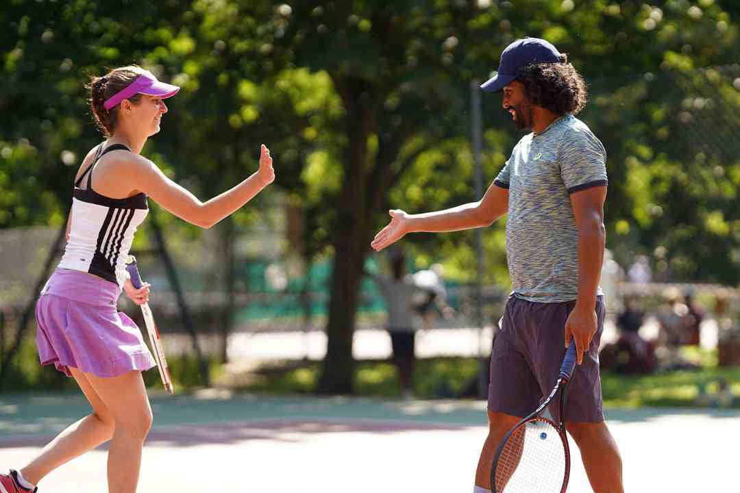 Competition players high-fiving during a match