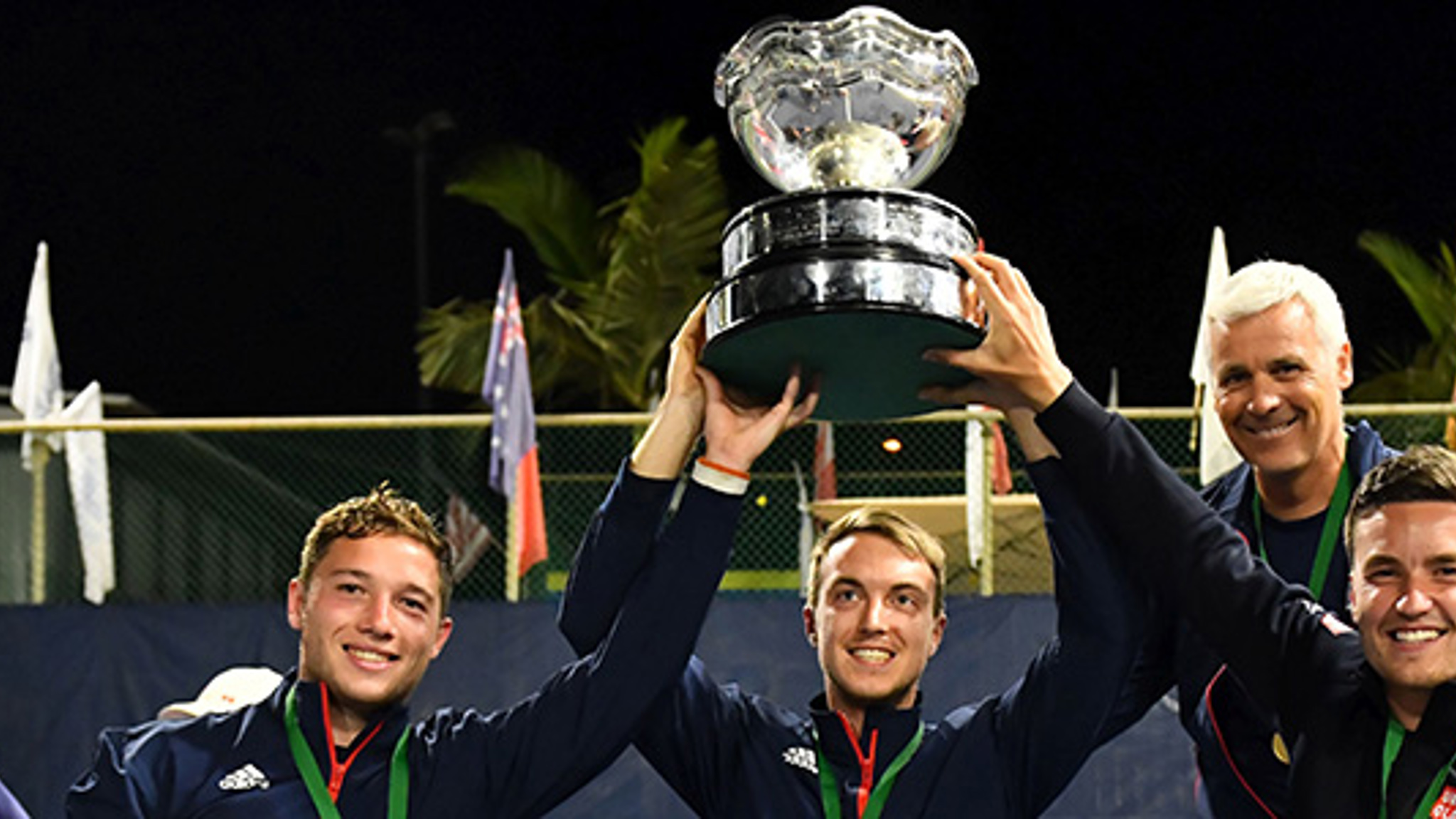 Great Britain's men's wheelchair tennis team hold their trophy in the air at the BNP Paribas world team cup in 2019