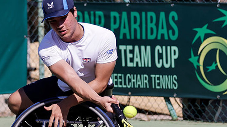 Dahnon Ward hitting a backhand at the World Team Cup