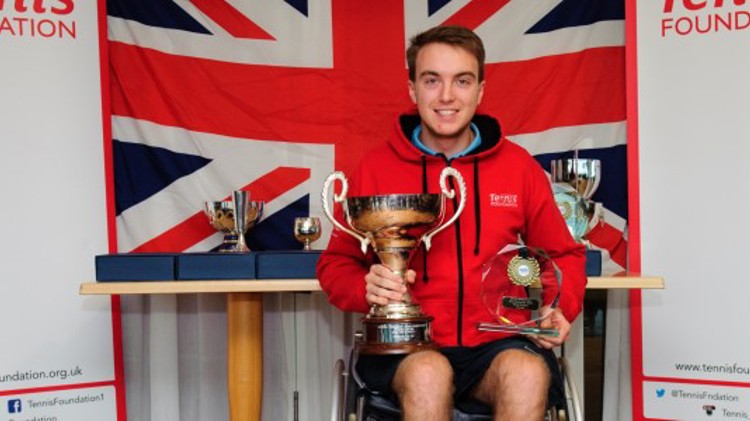Dermot Bailey holds the Men's Singles National trophy