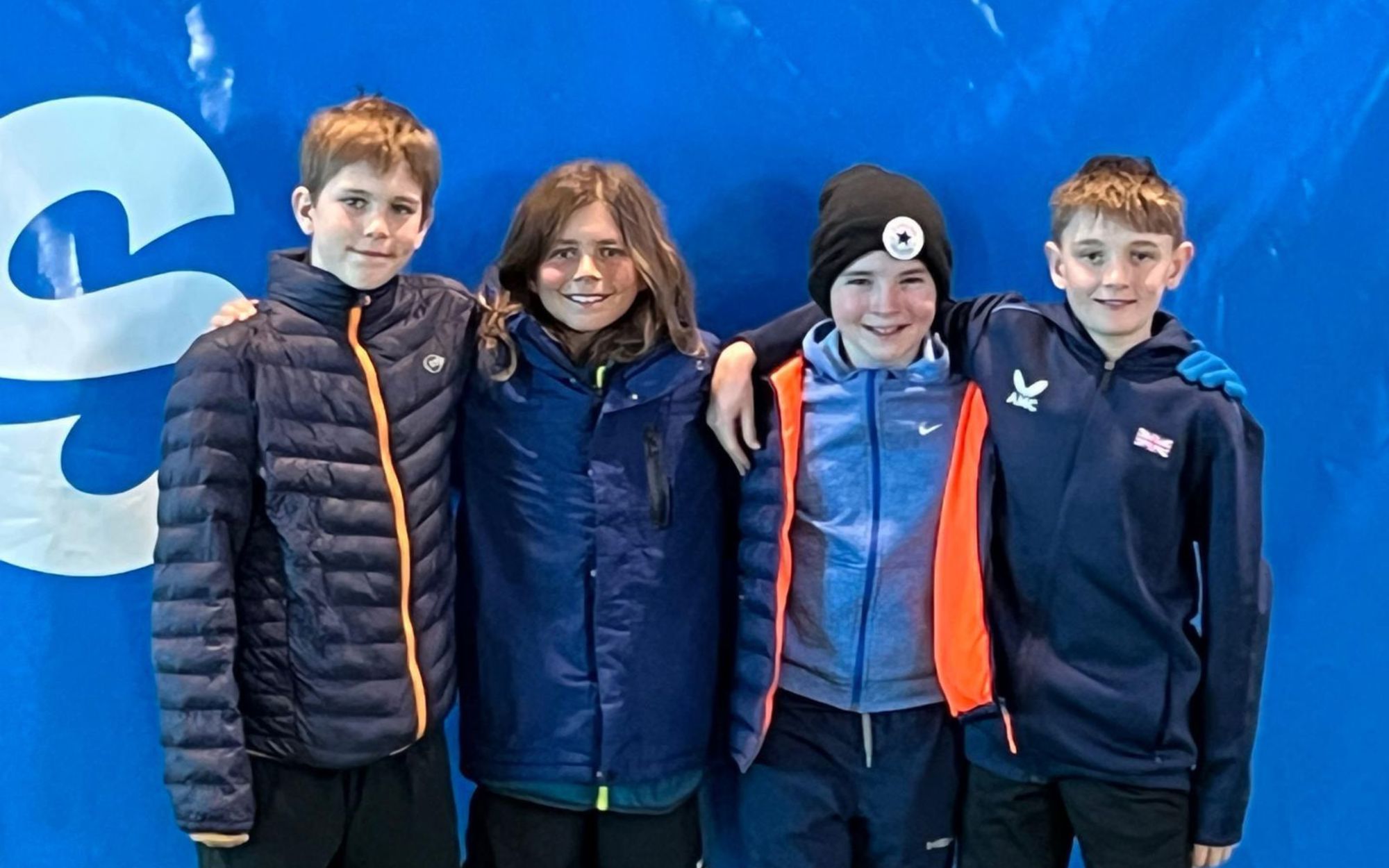 A group of young players posing after representing GB at an international match