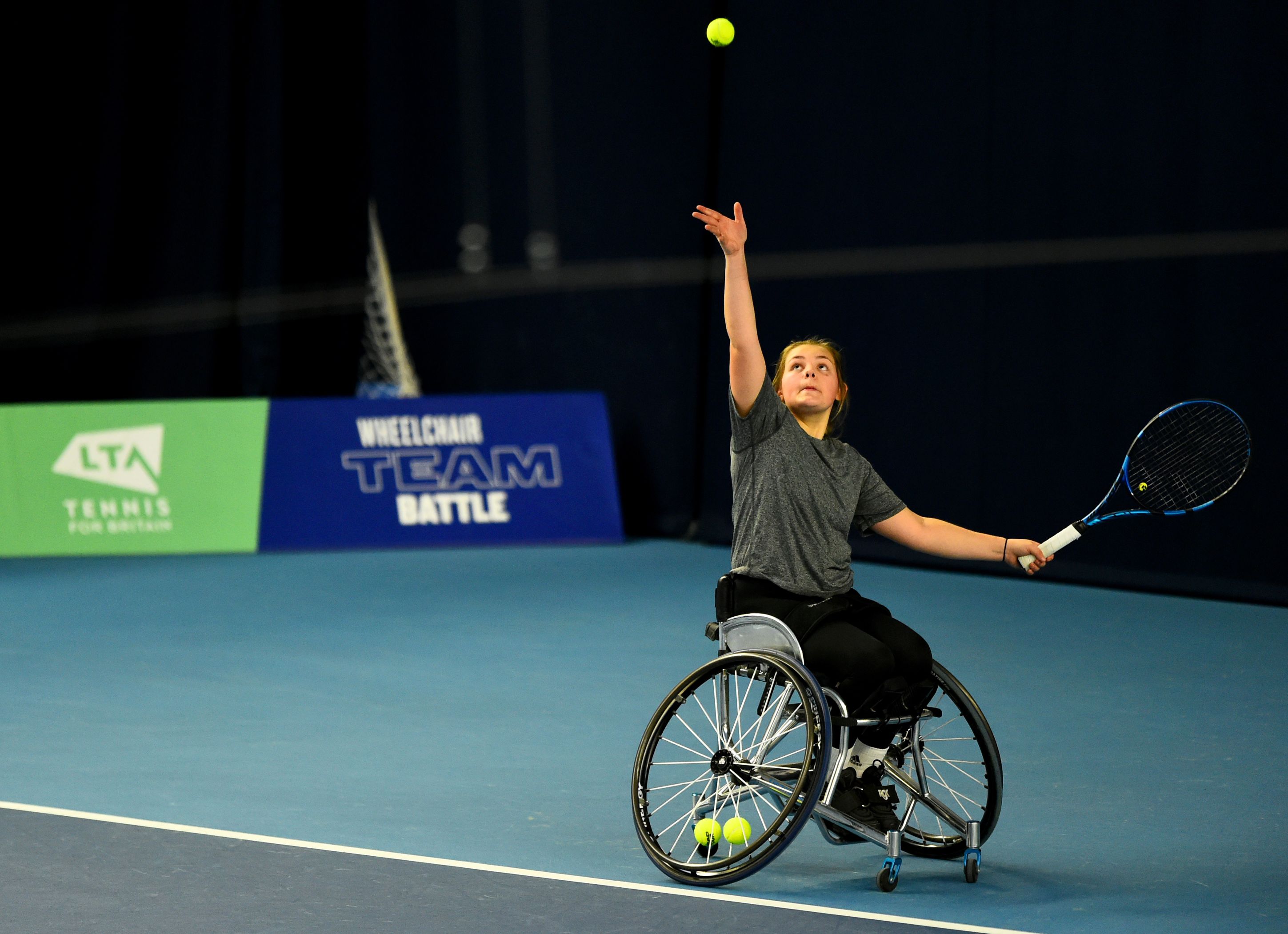 Ruby Bishop preparing to serve at the LTA Wheelchair Team Battle