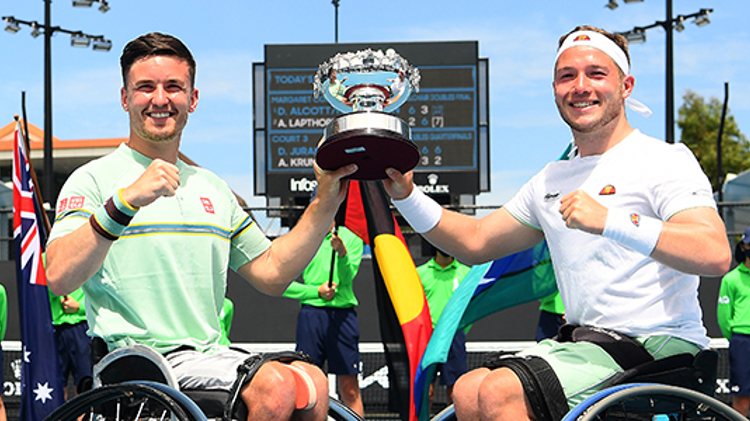 Alfie Hewett and Gordon Reid holding a trophy together