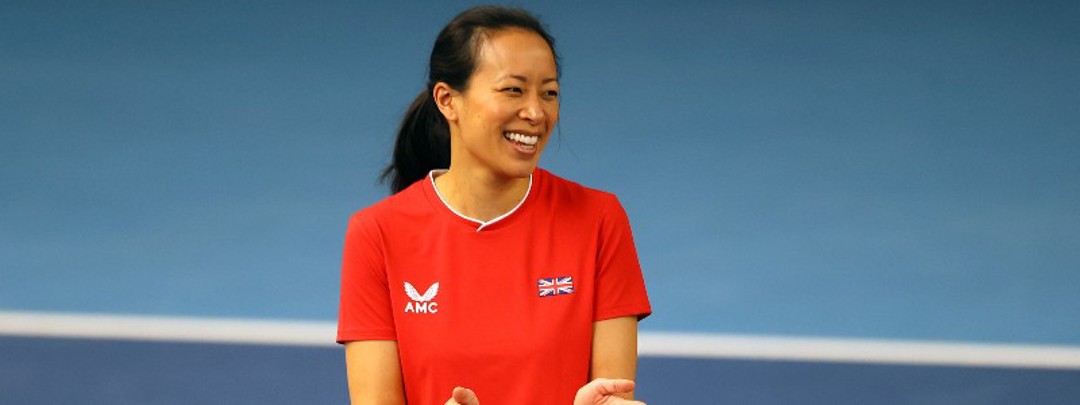 Anne Keothavong smiling for a picture and clapping