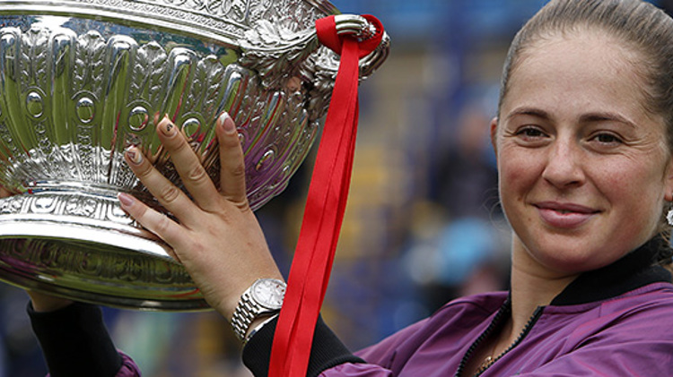 Jelena Ostapenko women's champion holding the 2021 Eastbourne trophy