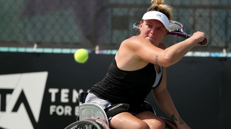 Jordanne Whiley single backhand on an LTA tennis court