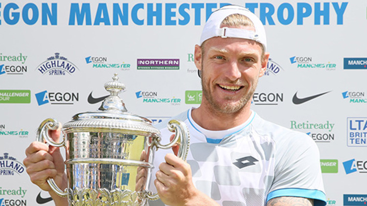 Sam Groth smiling with his Aegon Manchester trophy