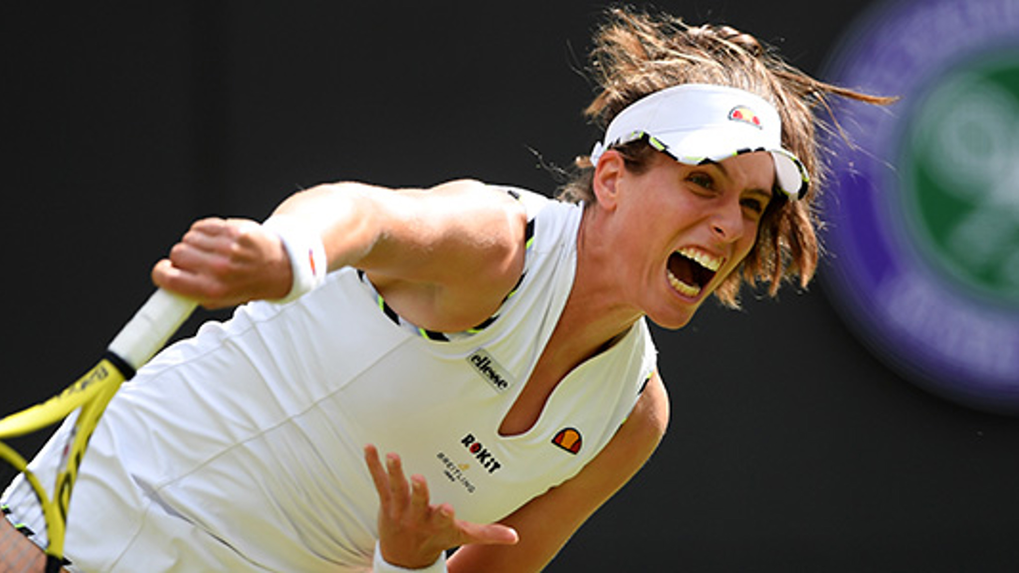 Johanna Konta serving a tennis shot at Wimbledon