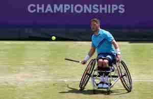 British wheelchair player Alfie Hewett hits a forehand on court at the cinch Championships