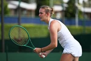 Edie Griffifths standing at the net ready to play a shot at the Lexus British Open Roehampton