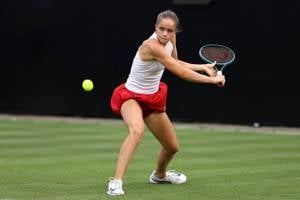 Megan KNight lines up a backhand slice at the Lexus British Open Roehampton