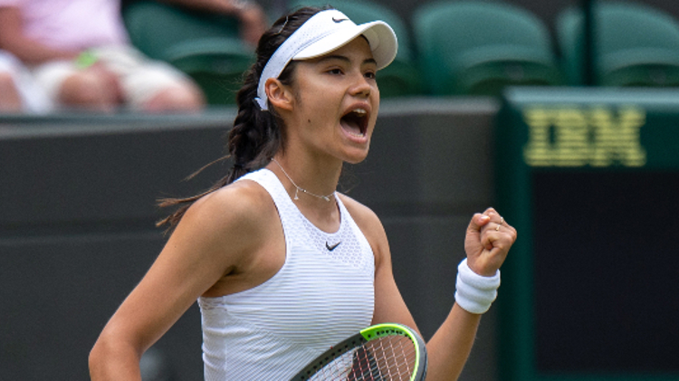 Emma Raducanu celebrating on a tennis court
