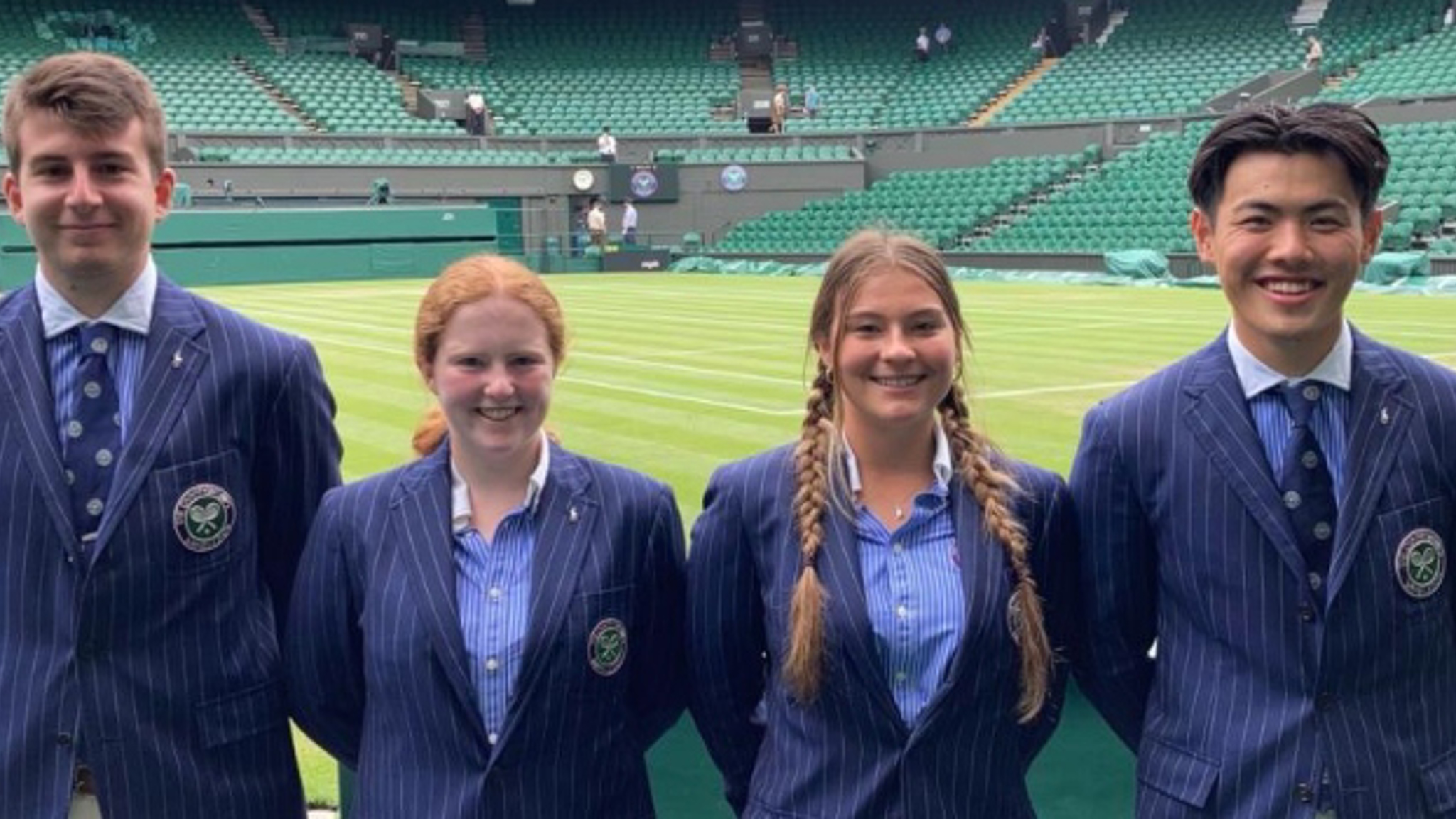 four new officials for the 134th championship standing in front of a Wimbledon tennis court