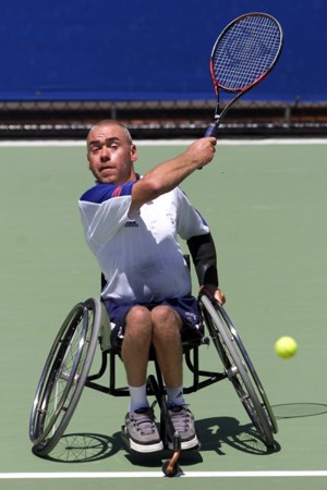 Simon Hatt hitting a forehand in a match