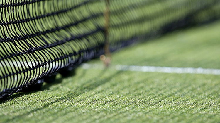 Close up of the bottom of a tennis net