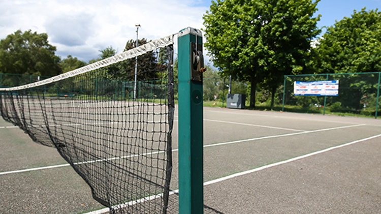 Tennis court net at a local park