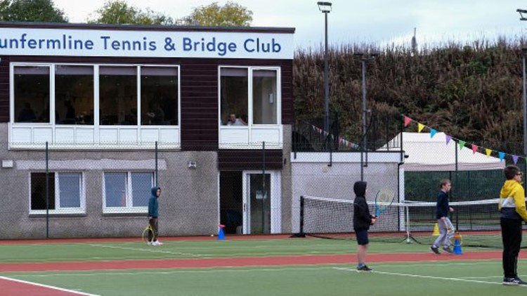 two tennis courts and clubhouse at the back at dunfemline tennis club