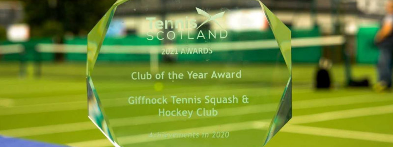 clear glass LTA award trophy with writing  saying club of the year award for giffnock tennis squash and hockey club