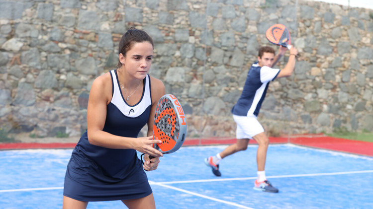 Two padel players waiting for their shot