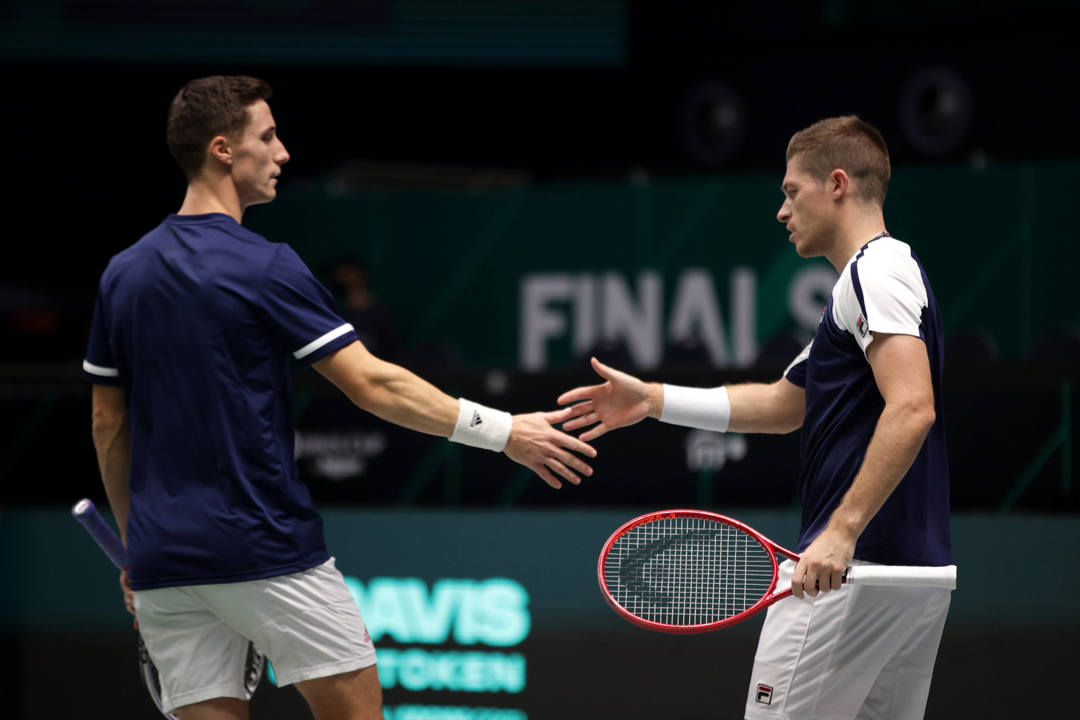 Joe Salisbury and Neal Skupski high five at the 2021 Davis Cup Finals
