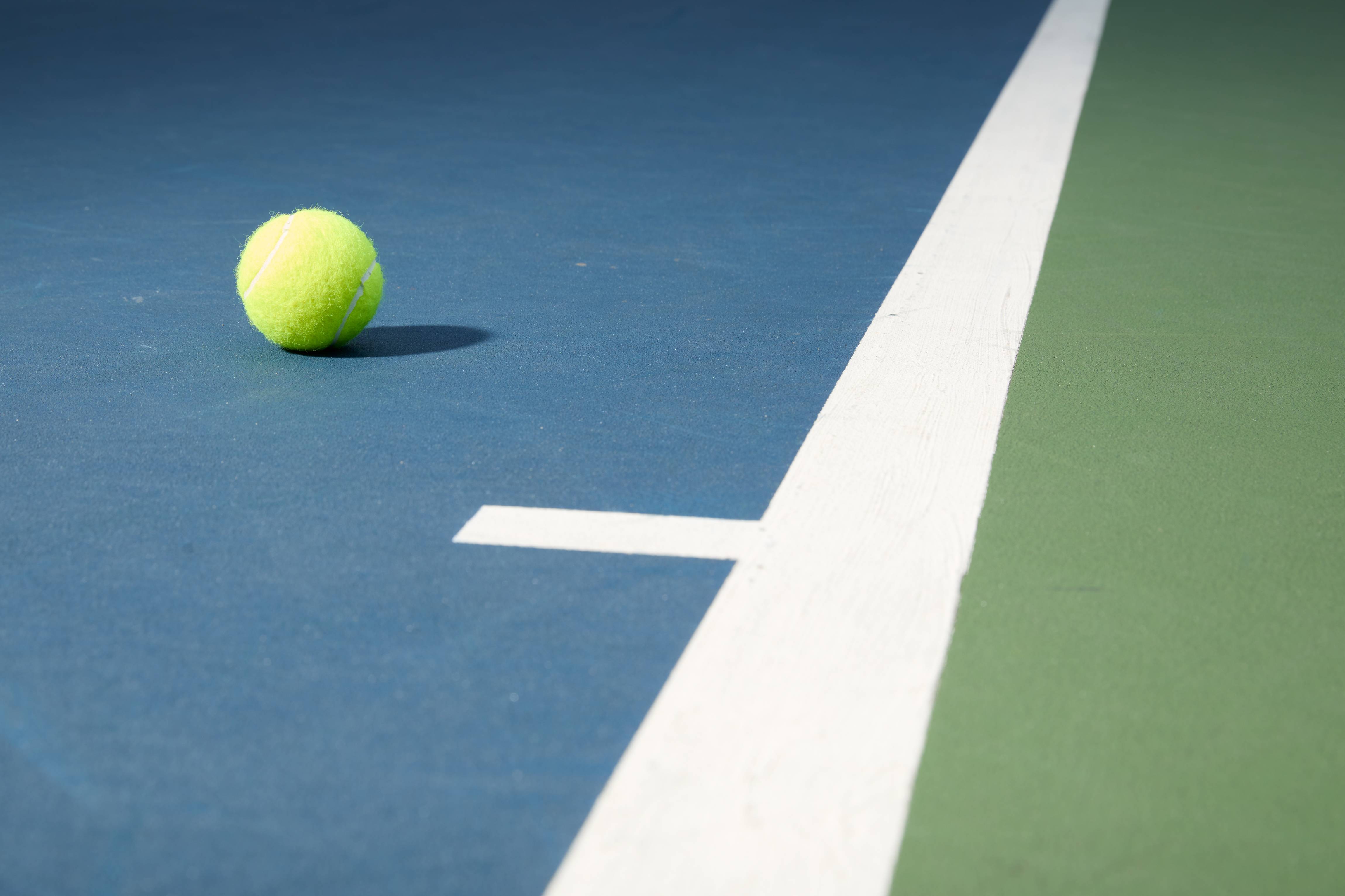 A tennis ball on a court