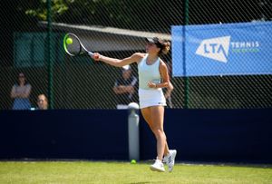 Millie Skelton hits a forehand at the Junior Nationals