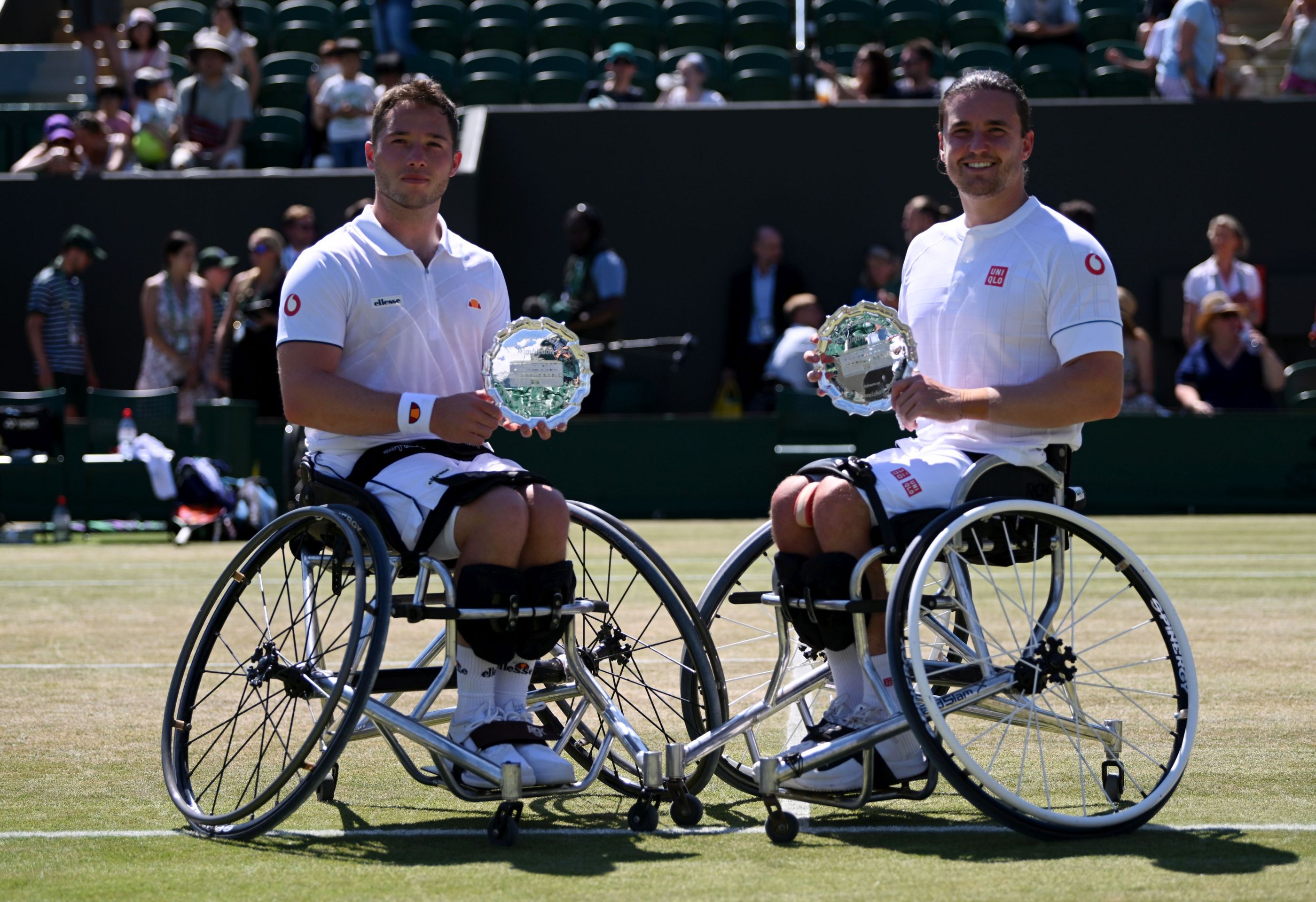 Alfie Hewett and Gordon Reid posing with their runners-up trophies after the men's Wheelchair doubles final at the 2022 Championships Wimbledon