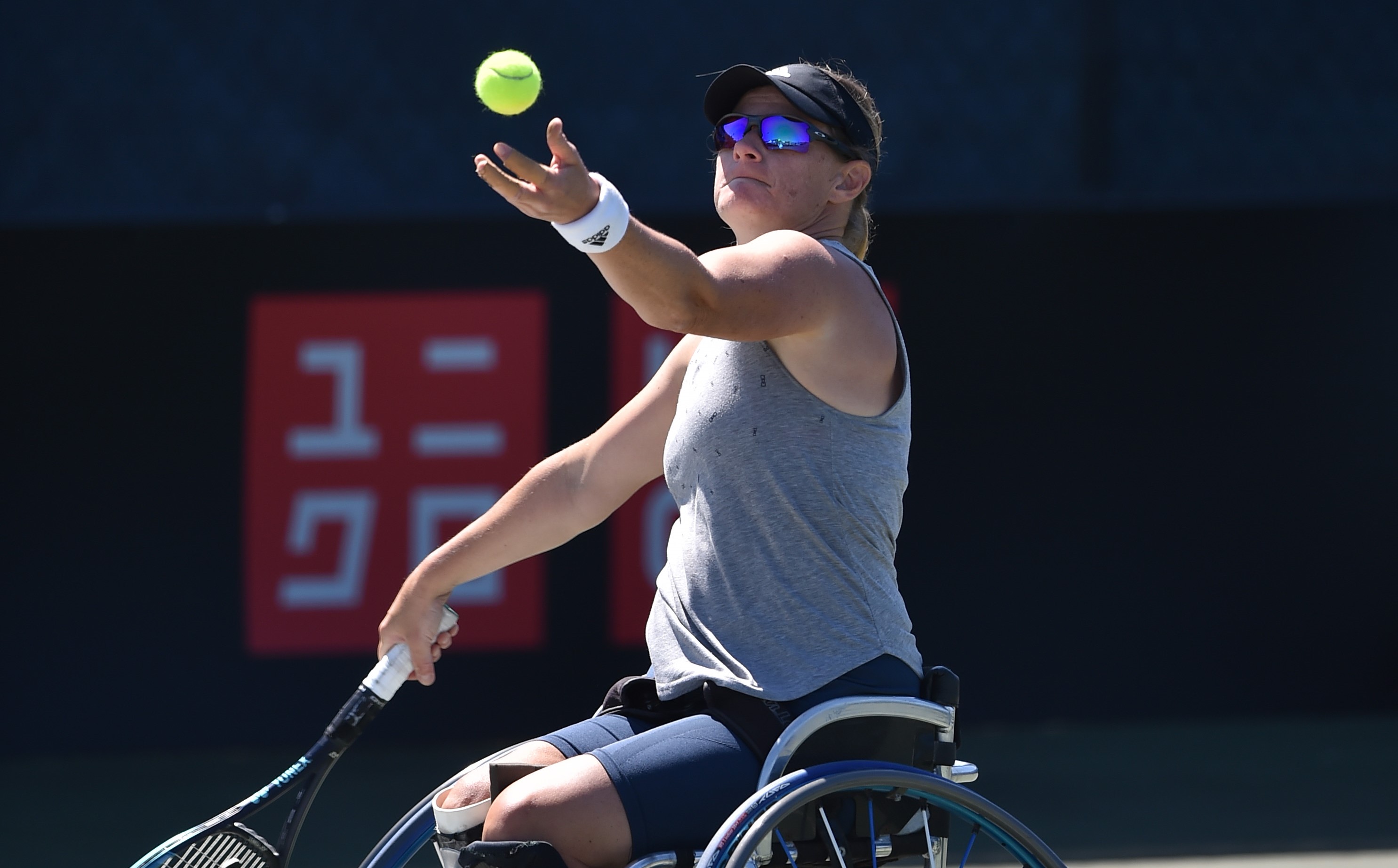 Cornelia Oosthuizen serving during her wheelchair women's singles quarter-final match at the 2022 British Open  