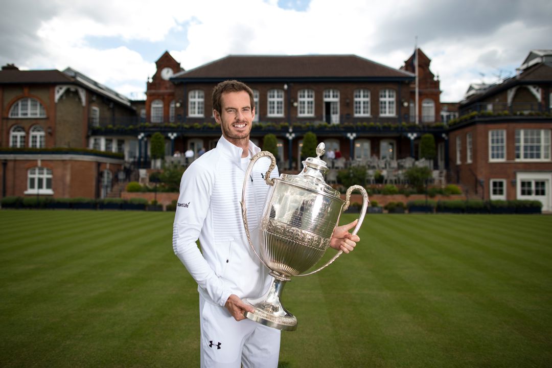 Andy Murray poses with the Queen's Championships trophy at the Queen's Club in 2017