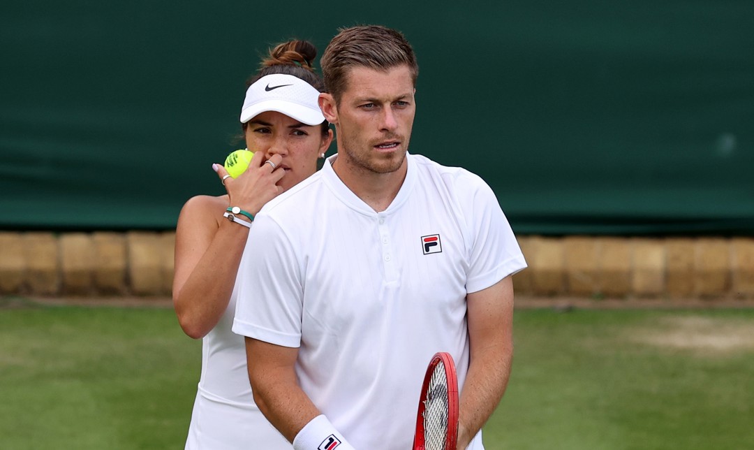 Neal Skupski and Desirae Krawczyk during their Mixed Doubles First Round match on day six of The Championships Wimbledon 2022 