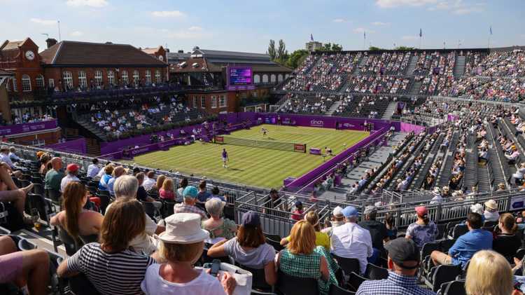 Grass court stadium filled with fans