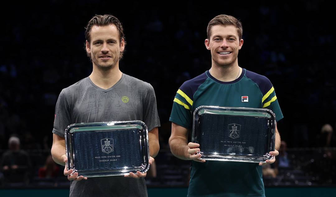 Neal Skupski and Wesley Koolhof holding the Rolex Paris Masters doubles trophy