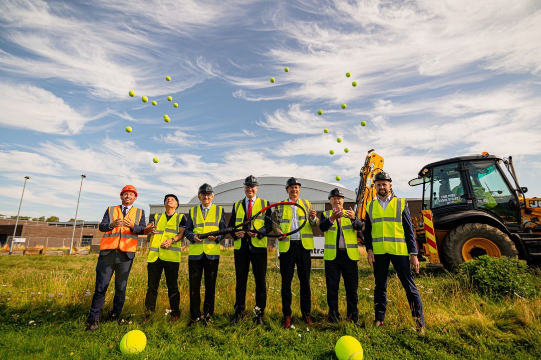 Builders on the construction site of the new indoor tennis courts at Oriam