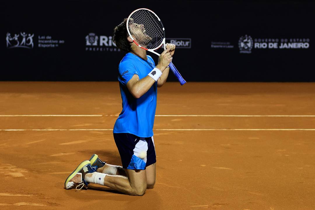 Cam Norrie collapses to his knees after winning the Rio Open
