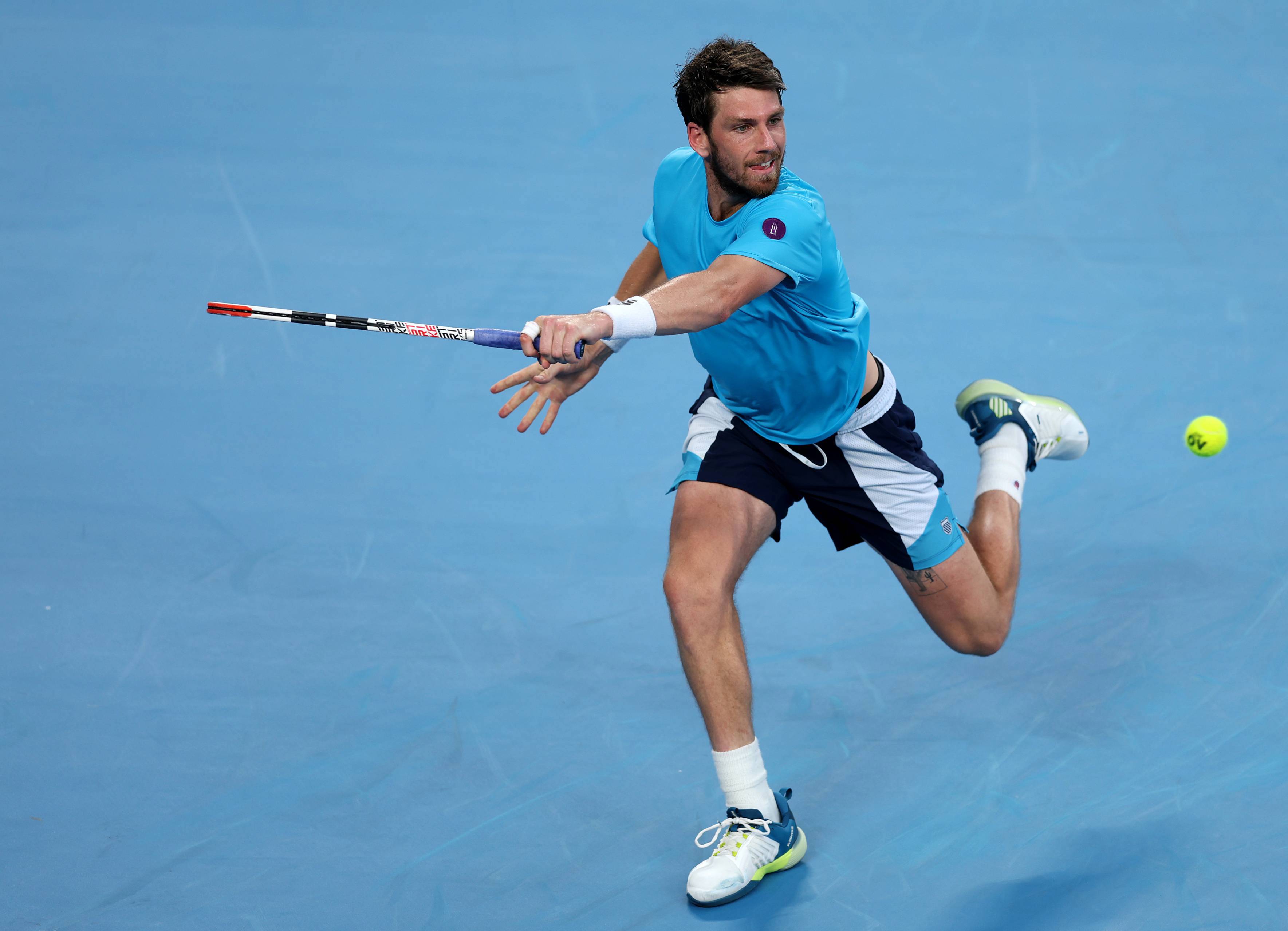 Cam Norrie reaches for a backhand in the opening round at the 2023 Australian Open