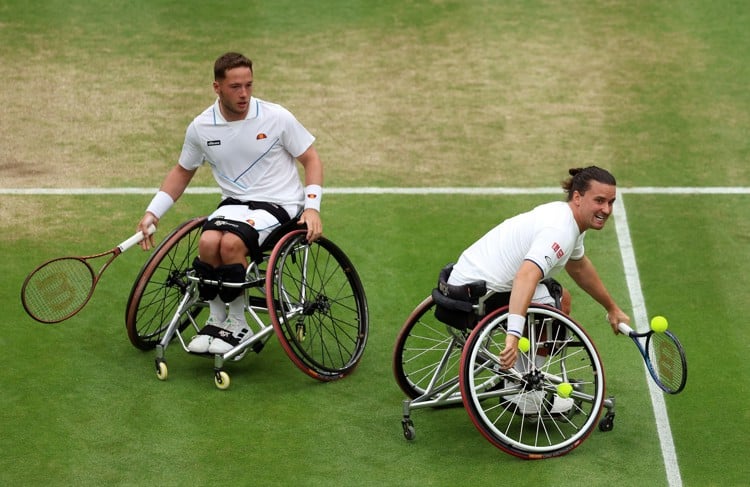 Alfie Hewett and Gordon Reid in action during the Gentleman's Wheelchair Doubles semi-final clash at The Championships, Wimbledon 2023