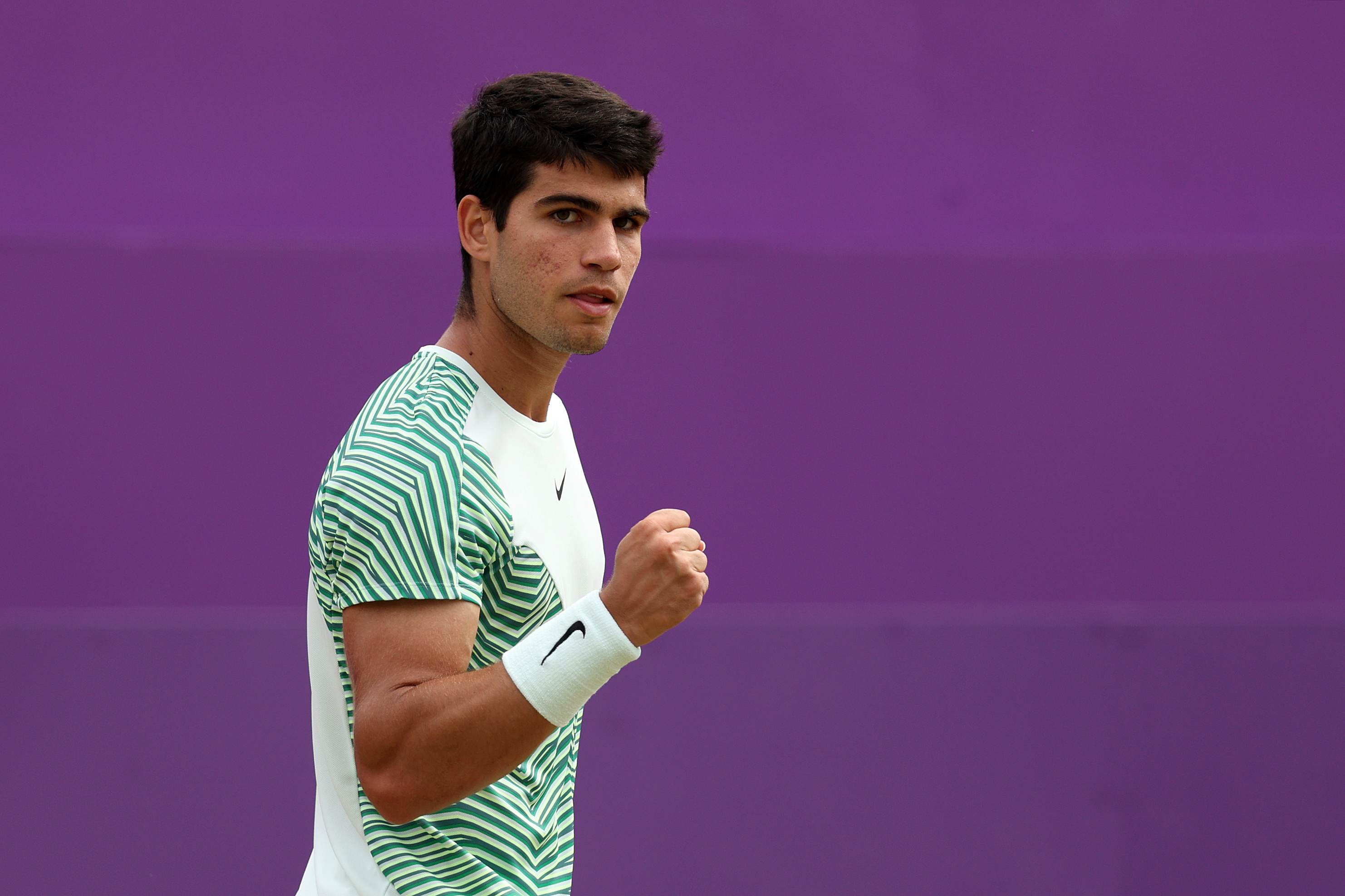 Carlos Alcaraz clenching his fist in celebration after winning his semi-final match against Sebastian Korda