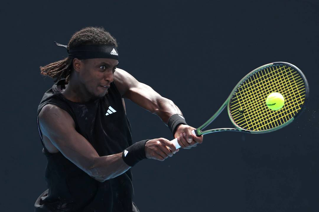 Mikael Ymer hitting a backhand at the Australian Open 