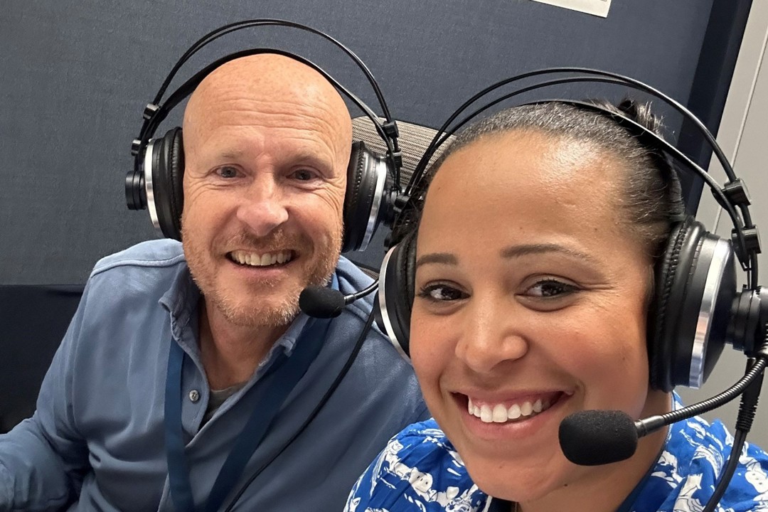 Yasmin Clarke in the broadcasting booth with Paul Hand