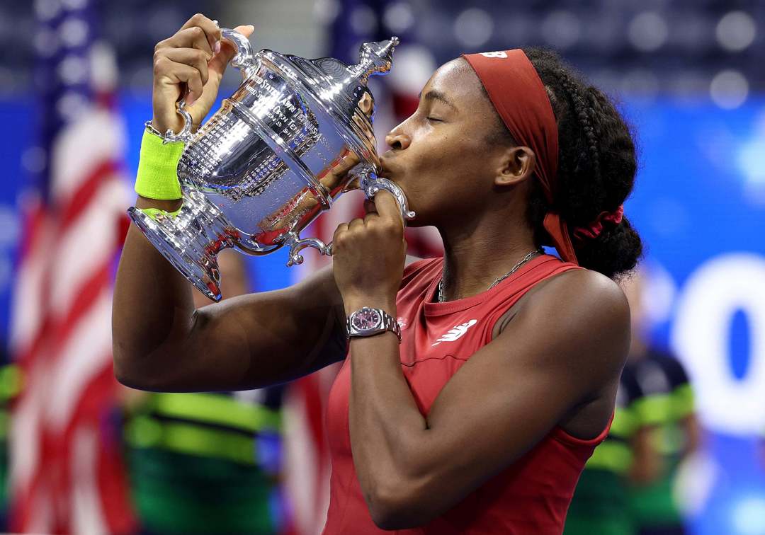 2023 US Open women's singles champion Coco Gauff holding her championship trophy while on court at the US Open 