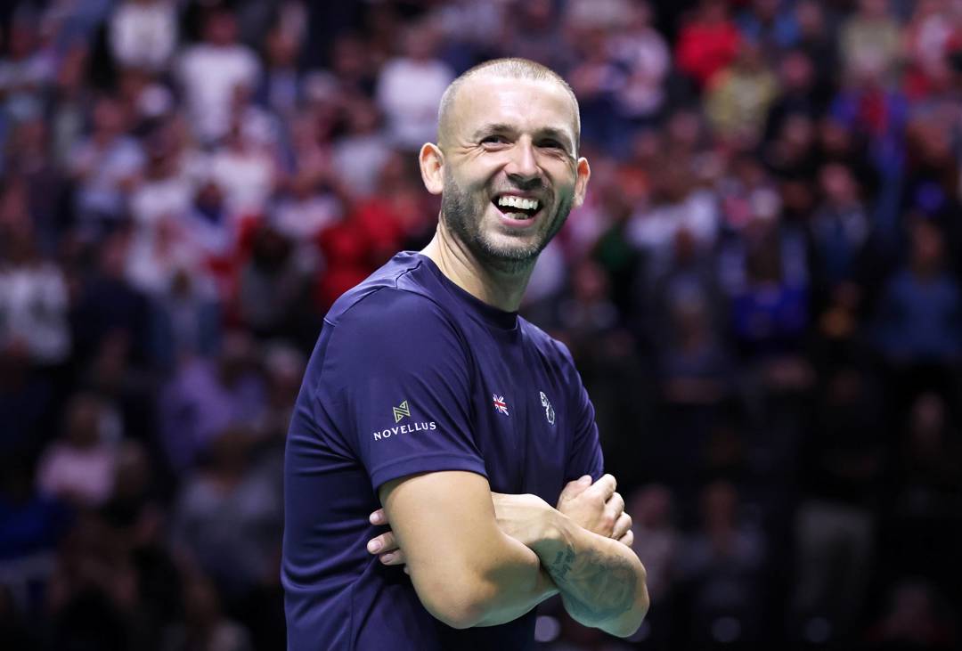 Dan Evans smiling after beating Alex De Minaur at the Davis Cup Finals