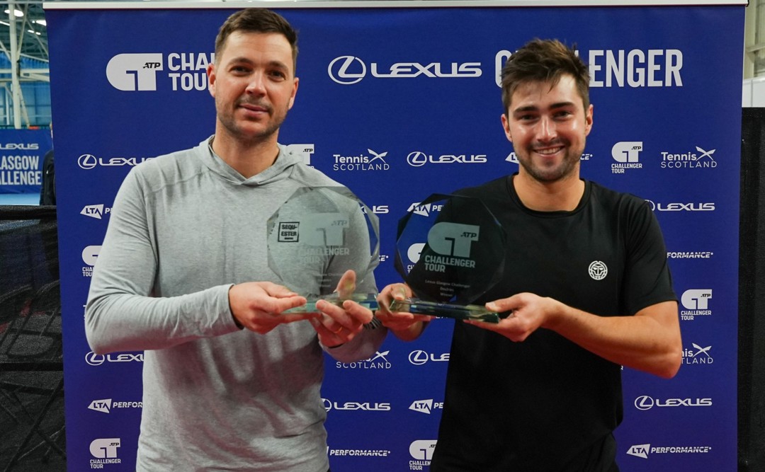 Scott Duncan and Marcus Willis holding their doubles trophies after winning the Lexus Glasgow Challenger