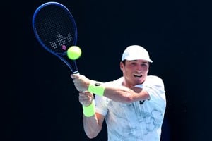 Oliver Crawford hitting a backhand at the Australian Open 2024