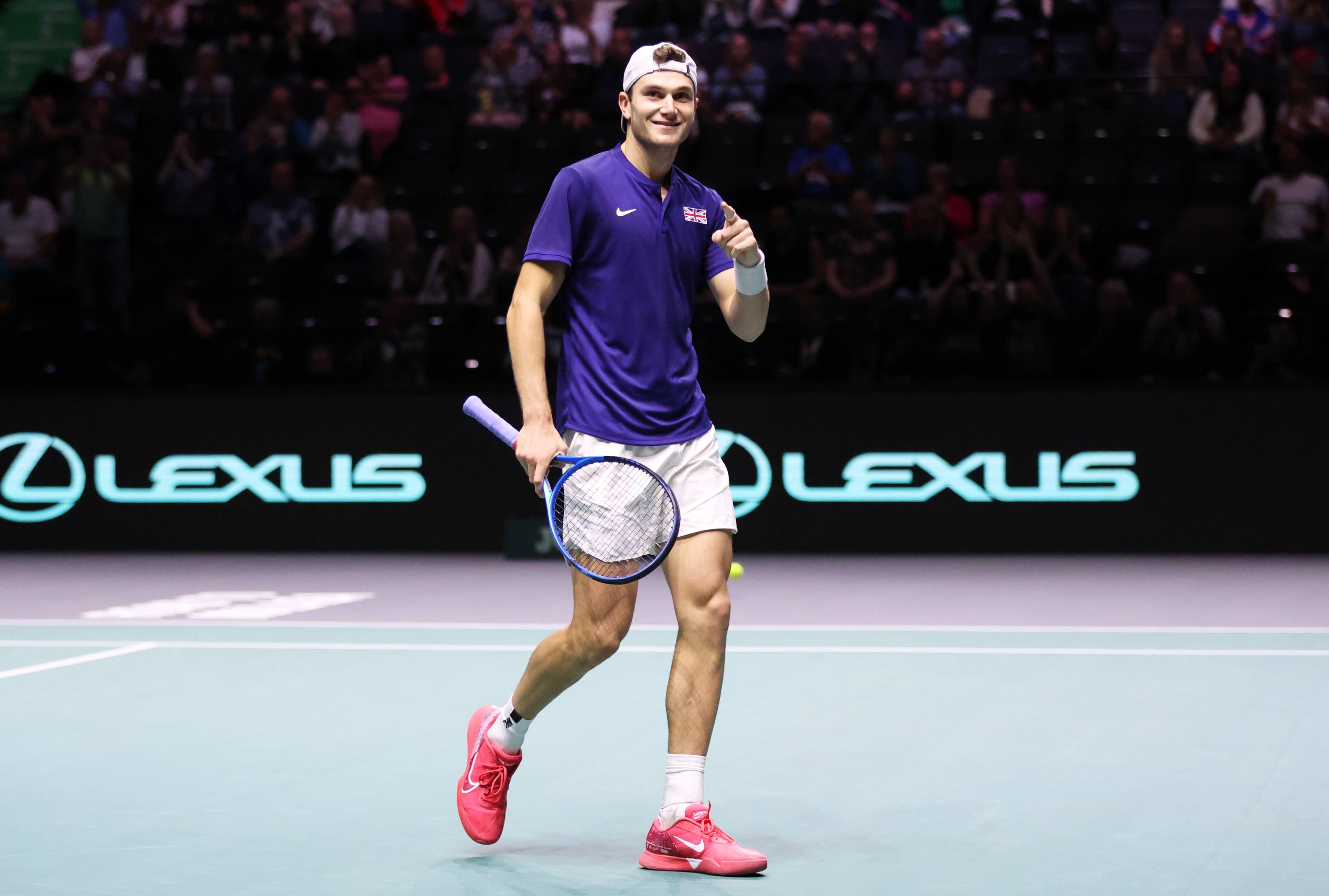 Jack Draper points to the crowd after winning his first Davis Cup match in Manchester