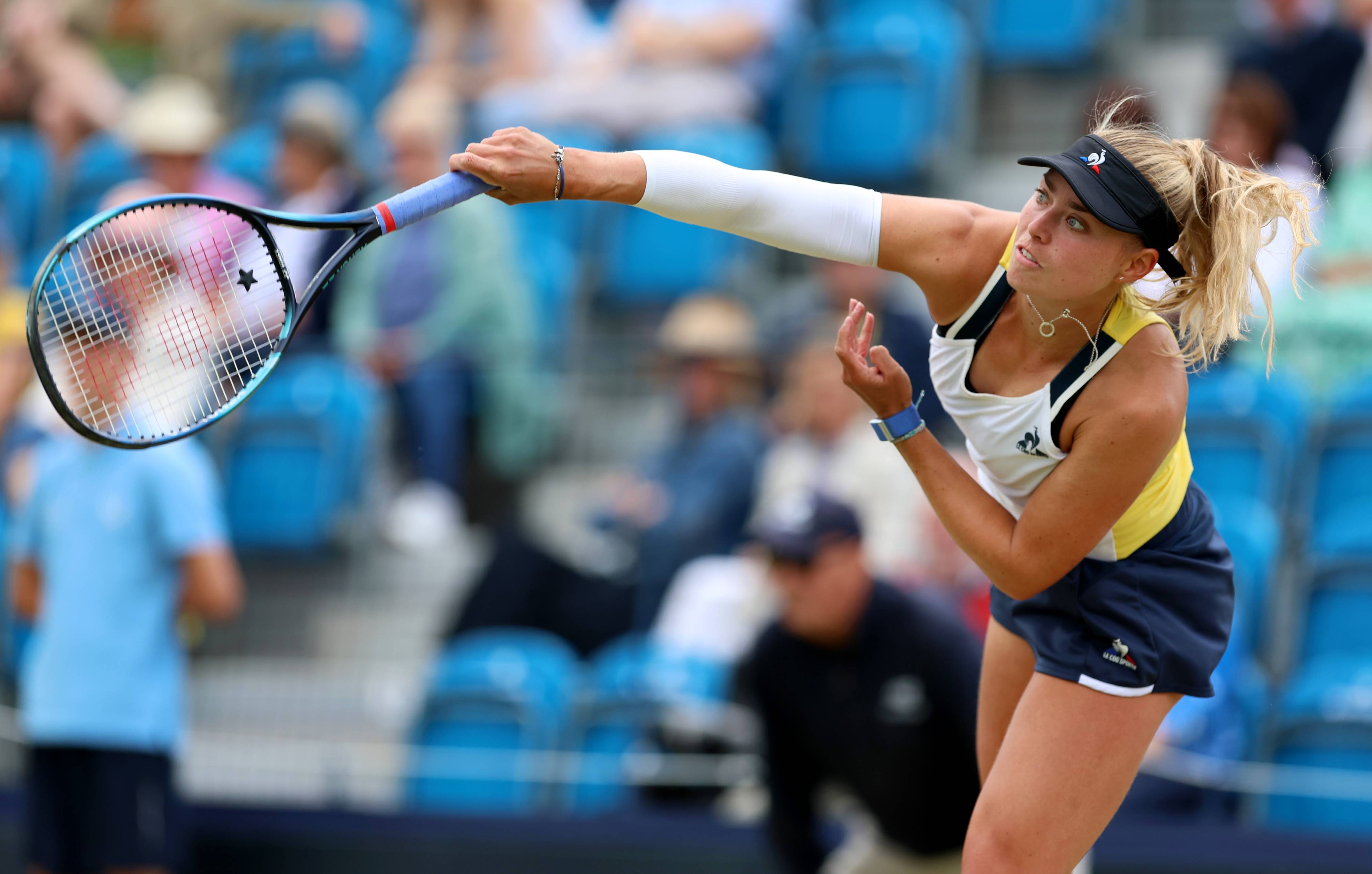 Emily Appleton serves at the Lexus Surbiton Trophy